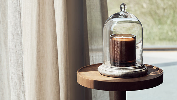 Candle covered by cloche on a stand | True Grace Journal