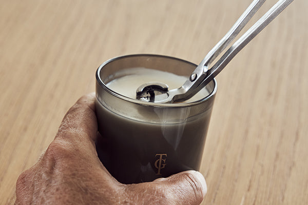 Wick being trimmed on a candle | True Grace Journal