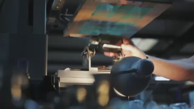 Bottles being printed in factory | True Grace Home fragrance